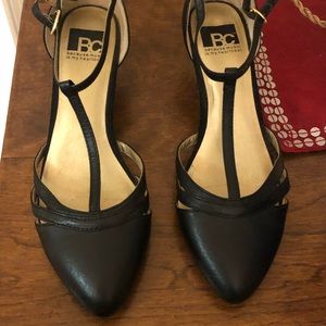 Black leather t-strap shoes with slight wedge